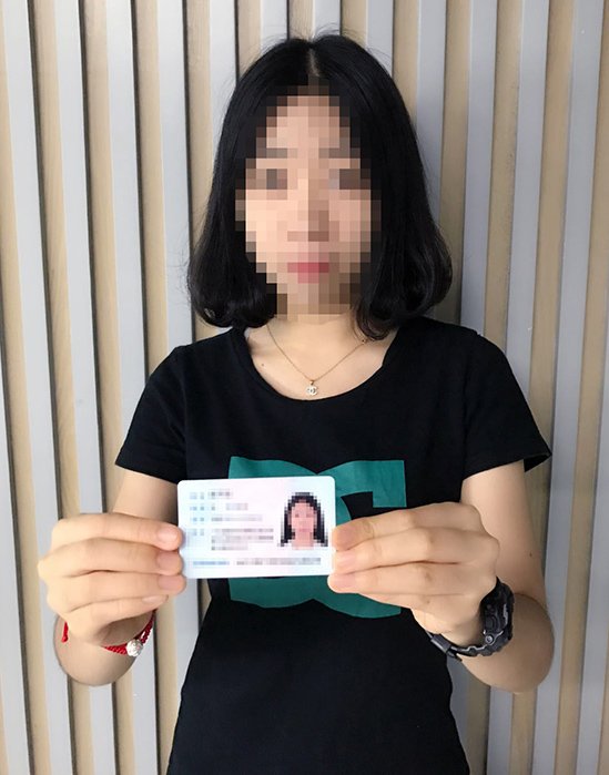 A picture of the person responsible for the website with their identity card in their hand